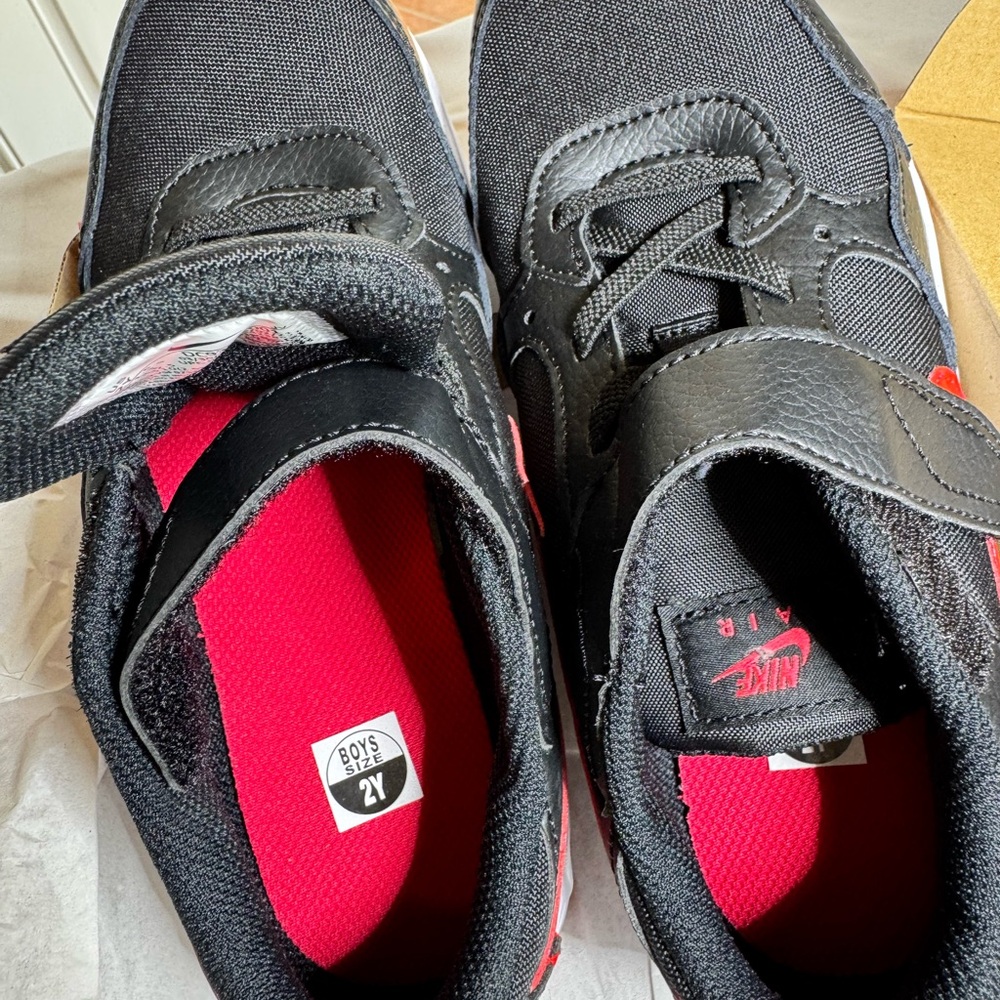Nike kids tennis shoes black and white  red logo new on the box without tags